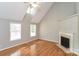 Bright living room with vaulted ceiling, wood floors, a fireplace, and abundant natural light at 1930 Manning Pl, Rock Hill, SC 29730