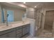 New bathroom showcasing dual sinks, grey cabinetry, and marble-tiled shower at 2009 Vinyasa Ln # Sts-44, Charlotte, NC 28215