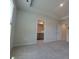 Spacious bedroom with neutral carpet and views into the bathroom at 2009 Vinyasa Ln # Sts-44, Charlotte, NC 28215