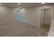 Spacious bedroom with neutral carpeting, featuring two closets and natural light at 2009 Vinyasa Ln # Sts-44, Charlotte, NC 28215