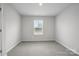 Bedroom with natural light from the window, neutral walls, and carpet floors at 2009 Vinyasa Ln # Sts-44, Charlotte, NC 28215