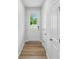 Bright entryway featuring a white door with glass, light wood floors, and white walls at 2009 Vinyasa Ln # Sts-44, Charlotte, NC 28215