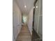 Entryway with hardwood floors leading into the living and kitchen area, featuring a half-bath at 2009 Vinyasa Ln # Sts-44, Charlotte, NC 28215