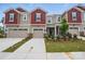 Charming townhome with red accents, a one-car garage, and a well-maintained front yard at 2009 Vinyasa Ln # Sts-44, Charlotte, NC 28215