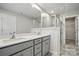 Luxurious bathroom showcasing double sink vanity, quartz countertops, and a glass-enclosed shower at 2009 Vinyasa Ln # Sts-44, Charlotte, NC 28215