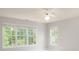 Bedroom filled with natural light from multiple windows and features a ceiling fan at 20135 Northport Dr, Cornelius, NC 28031