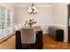 Elegant dining room featuring hardwood floors, wainscoting, and ample space for Gathering gatherings at 20135 Northport Dr, Cornelius, NC 28031