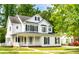Charming two-story home with a covered front porch, black shutters, and a well-maintained lawn at 20135 Northport Dr, Cornelius, NC 28031