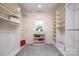 Spacious walk-in closet with custom shelving and natural light at 20135 Northport Dr, Cornelius, NC 28031