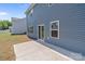 Back patio with a concrete slab and door into the home, perfect for entertaining or relaxing outdoors at 2022 Mcdonald Dr, Stanfield, NC 28163