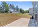 Spacious backyard featuring a large grassy area, mature trees, and privacy fencing, ideal for outdoor activities at 2022 Mcdonald Dr, Stanfield, NC 28163