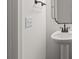 Bathroom featuring a pedestal sink, medicine cabinet, and modern matte black fixtures at 2022 Mcdonald Dr, Stanfield, NC 28163