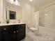 Full bathroom with dark vanity, providing a fresh space at 2022 Mcdonald Dr, Stanfield, NC 28163