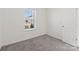 Bedroom featuring carpet and a window overlooking the neighborhood at 2022 Mcdonald Dr, Stanfield, NC 28163