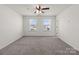 Bright bedroom with two windows and ceiling fan at 2022 Mcdonald Dr, Stanfield, NC 28163
