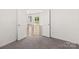 Bedroom with open doorway featuring carpet floors at 2022 Mcdonald Dr, Stanfield, NC 28163