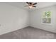Bedroom with window, ceiling fan, and neutral decor at 2022 Mcdonald Dr, Stanfield, NC 28163