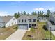 Charming two-story home featuring blue and white siding, a two-car garage, and a manicured front yard at 2022 Mcdonald Dr, Stanfield, NC 28163