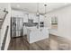 Modern kitchen featuring stainless steel appliances, a center island, and pendant lights at 2022 Mcdonald Dr, Stanfield, NC 28163