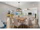 This open concept living room is virtually staged and includes patio access, a dining area and white furniture at 2022 Mcdonald Dr, Stanfield, NC 28163