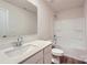 Bathroom featuring single sink vanity, framed mirror, luxury vinyl plank flooring and shower-tub combo at 2106 Columbidae Ln, Gastonia, NC 28052