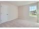 Inviting bedroom with neutral walls, carpet flooring and bright window to allow natural light at 2106 Columbidae Ln, Gastonia, NC 28052