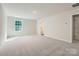 Cozy bedroom with plush carpeting, neutral paint, bright window and standard closet for ample storage at 2106 Columbidae Ln, Gastonia, NC 28052