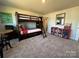 Spacious bedroom featuring a bunk bed, a small table, and lots of room at 21110 Bank Fire Ln, Huntersville, NC 28078