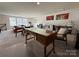 Large bonus room offering multiple workstations, a seating area, and ample space for activities at 21110 Bank Fire Ln, Huntersville, NC 28078
