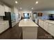 Bright kitchen features a large island with white countertops and modern appliances at 21110 Bank Fire Ln, Huntersville, NC 28078
