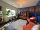 Cozy living room with vibrant blue accent wall, plants, and natural light at 21110 Bank Fire Ln, Huntersville, NC 28078