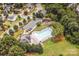 Aerial view of a community pool, playground, and parking, showcasing a Gathering-friendly neighborhood at 219 Pleasant Grove Ln, Mooresville, NC 28115