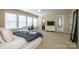 Large bedroom with ceiling fan, desk, TV and plenty of natural light at 219 Pleasant Grove Ln, Mooresville, NC 28115