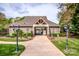 Community clubhouse entrance with manicured landscaping, providing a welcoming space for residents at 219 Pleasant Grove Ln, Mooresville, NC 28115