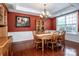 Formal dining room with traditional decor, hardwood floors, and plenty of natural light at 219 Pleasant Grove Ln, Mooresville, NC 28115