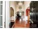 Elegant foyer with high ceilings, hardwood floors, and architectural details leading to living areas at 219 Pleasant Grove Ln, Mooresville, NC 28115