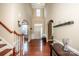 Grand foyer featuring hardwood floors, arched entryways, and a staircase to the upper level at 219 Pleasant Grove Ln, Mooresville, NC 28115