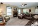 Inviting living room featuring a fireplace and comfortable seating arrangements at 219 Pleasant Grove Ln, Mooresville, NC 28115