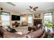 Cozy living room with a fireplace, large TV, and comfortable leather seating at 219 Pleasant Grove Ln, Mooresville, NC 28115