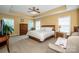 Spacious main bedroom with tray ceiling, carpet floors, and natural light at 219 Pleasant Grove Ln, Mooresville, NC 28115