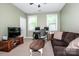 Comfortable office space with ample lighting, comfortable seating, and office desk at 219 Pleasant Grove Ln, Mooresville, NC 28115