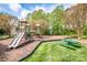Well-equipped playground area with slides, swings, and picnic tables for community enjoyment at 219 Pleasant Grove Ln, Mooresville, NC 28115