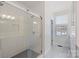 Modern bathroom highlighting a glass-enclosed shower, patterned floor tiles, and custom cabinets at 2306 Club Rd, Charlotte, NC 28205