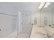Bathroom with tiled shower and tub and a door that provides access to other rooms at 2306 Club Rd, Charlotte, NC 28205