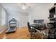 Bedroom featuring a desk, chair, treadmill, light hardwood floors, and white trim at 2306 Club Rd, Charlotte, NC 28205