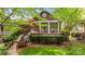 Charming home featuring a welcoming porch, landscaped yard, and beautiful curb appeal at 2306 Club Rd, Charlotte, NC 28205