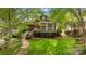 Charming home featuring a welcoming porch, landscaped yard, and beautiful curb appeal at 2306 Club Rd, Charlotte, NC 28205