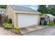 Attached two car garage with white door at 2306 Club Rd, Charlotte, NC 28205