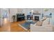 Bright living room with fireplace, modern chandelier, hardwood floors, and stylish decor at 2306 Club Rd, Charlotte, NC 28205