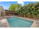 Secluded backyard pool area with a covered seating area and lush landscaping for a private oasis at 2306 Club Rd, Charlotte, NC 28205